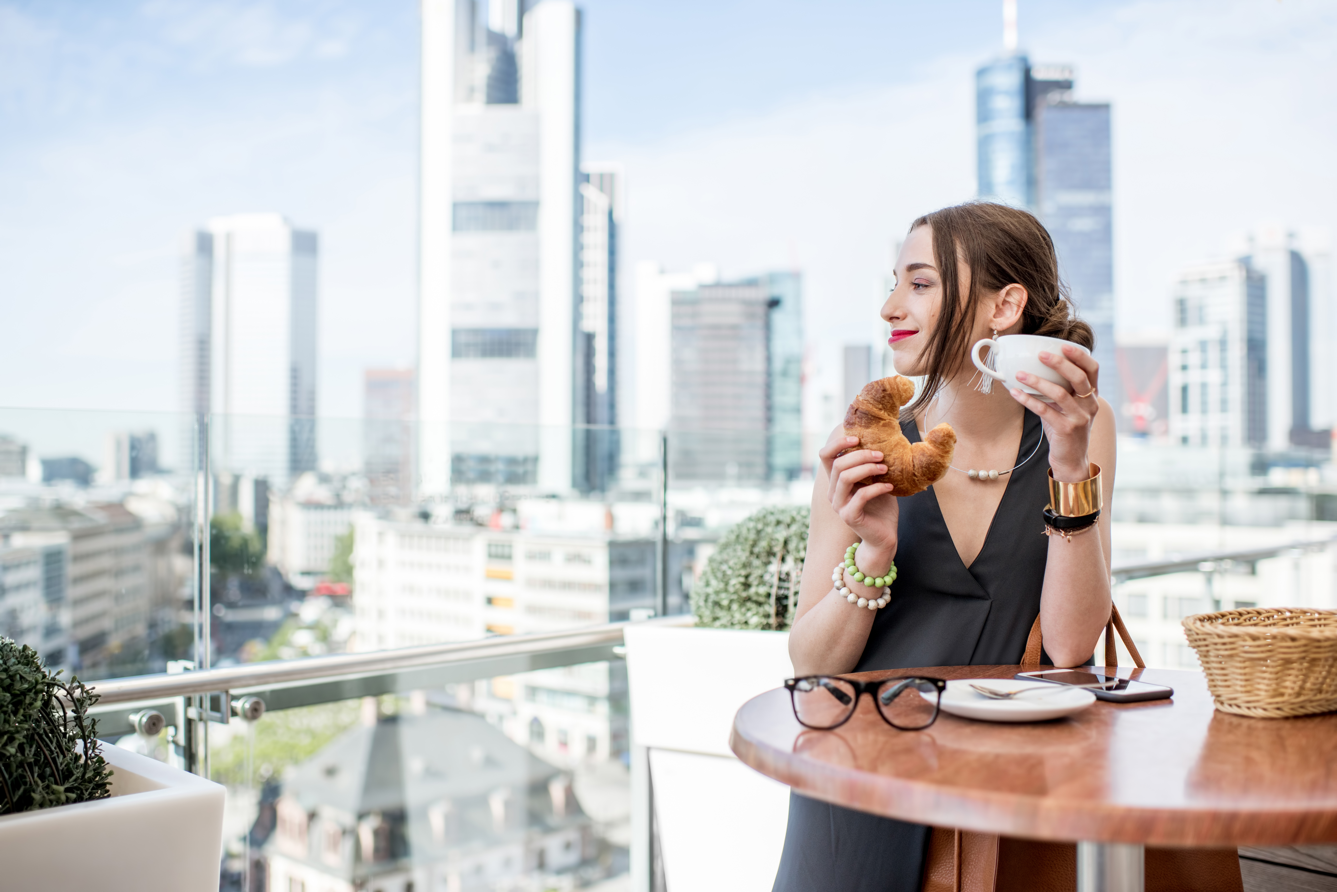 Businesswoman looking over Frankfurt skyline