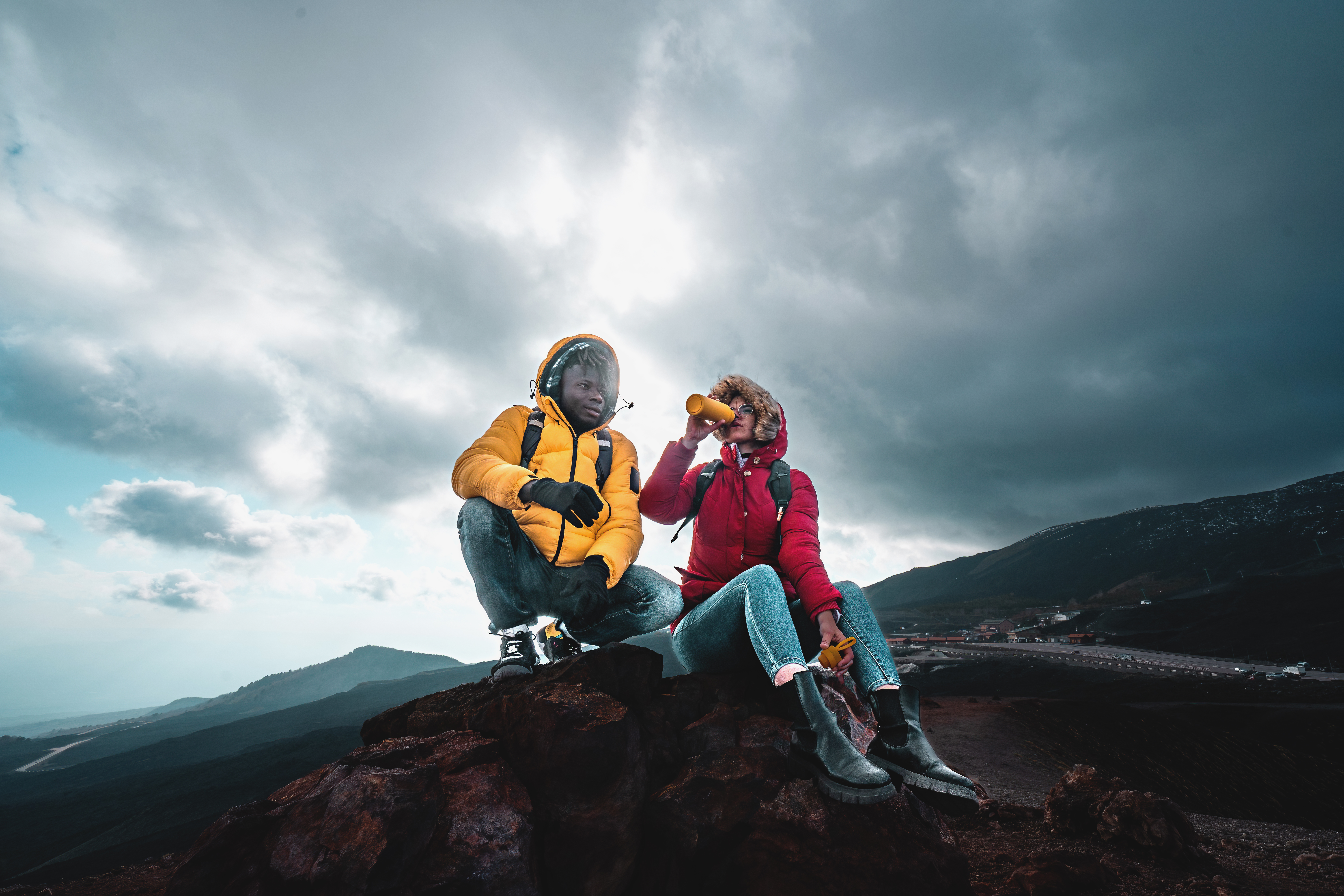 Hikers relaxing on a mountain top